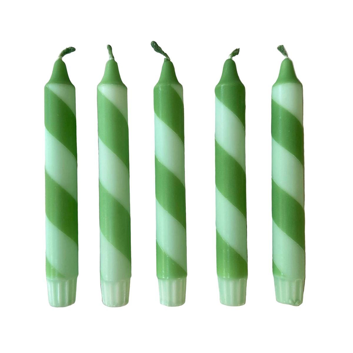 Velas de bastón  a rayas verdes coloridas sumergidas a mano