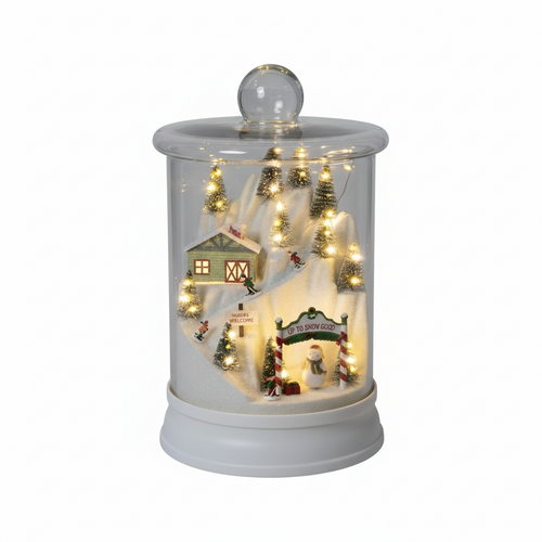 Cúpula de cristal con estación de esquí iluminada