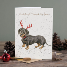 Cargar imagen en el visor de la galería, Tarjeta de Navidad &quot; Teckel a través de la nieve&quot;