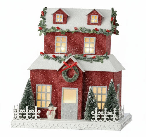 Casa de Pueblo Navideña con Purpurina Roja, Valla y Muñeco de Nieve ( 26.5 cm)