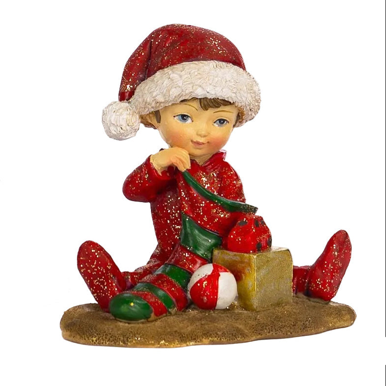 Figuras en forma de niño con gorro de Santa